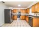 Kitchen with stainless steel appliances and wood cabinets at 408 Patrick Ave, Winter Haven, FL 33880