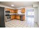 Kitchen with stainless steel appliances and wood cabinets at 408 Patrick Ave, Winter Haven, FL 33880