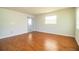 Living room with hardwood floors and exterior access at 408 Patrick Ave, Winter Haven, FL 33880