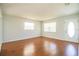 Bright living room featuring hardwood floors and neutral walls at 408 Patrick Ave, Winter Haven, FL 33880