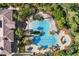 Aerial view of resort-style pool with surrounding landscaping at 4108 Solamor St, Lakeland, FL 33810