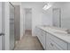 Double vanity bathroom with a walk-in shower at 4108 Solamor St, Lakeland, FL 33810