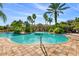 Community pool with palm trees and lounge chairs at 4108 Solamor St, Lakeland, FL 33810