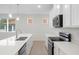 Modern kitchen with white cabinets and stainless steel appliances at 4108 Solamor St, Lakeland, FL 33810