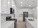 Modern kitchen with white cabinets and island at 4108 Solamor St, Lakeland, FL 33810