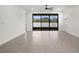 Bright living area with sliding glass doors to patio at 4108 Solamor St, Lakeland, FL 33810