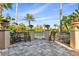 Relaxing poolside patio with benches and lush landscaping at 4108 Solamor St, Lakeland, FL 33810