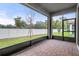 Screened patio with pavers and backyard view at 4108 Solamor St, Lakeland, FL 33810