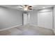 Well-lit bedroom with ceiling fan and double-door closet at 4185 Shearwater St, Lakeland, FL 33811