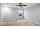 Cozy bedroom with carpet flooring and a window view at 4185 Shearwater St, Lakeland, FL 33811