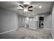 Bright bonus room featuring a ceiling fan and carpet at 4185 Shearwater St, Lakeland, FL 33811