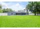 Large backyard with pool and screened enclosure at 4225 Shadow Wood Ct, Winter Haven, FL 33880