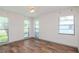 Well-lit bedroom with hardwood floors and multiple windows at 4225 Shadow Wood Ct, Winter Haven, FL 33880