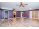 Primary bedroom with hardwood floors, multiple ceiling fans at 4225 Shadow Wood Ct, Winter Haven, FL 33880