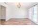 Spacious dining area with hardwood floors and chandelier at 4225 Shadow Wood Ct, Winter Haven, FL 33880