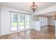 Bright dining room with hardwood floors and large windows at 4225 Shadow Wood Ct, Winter Haven, FL 33880