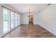 Bright dining room with hardwood floors and chandelier at 4225 Shadow Wood Ct, Winter Haven, FL 33880