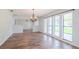 Bright dining room features hardwood floors and large windows at 4225 Shadow Wood Ct, Winter Haven, FL 33880