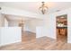 Open dining area with hardwood floors, view of kitchen at 4225 Shadow Wood Ct, Winter Haven, FL 33880