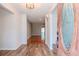 Inviting entryway with hardwood floors and a view into the living room at 4225 Shadow Wood Ct, Winter Haven, FL 33880