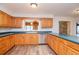 Kitchen with wood cabinets, stainless steel appliances and island at 4225 Shadow Wood Ct, Winter Haven, FL 33880