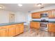 Kitchen with wood cabinets, stainless steel appliances and island at 4225 Shadow Wood Ct, Winter Haven, FL 33880