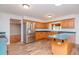 Kitchen with wood cabinets, stainless steel appliances and island at 4225 Shadow Wood Ct, Winter Haven, FL 33880