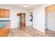 Kitchen with wood cabinets and view into the living area at 4225 Shadow Wood Ct, Winter Haven, FL 33880