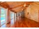 Vaulted ceilings and hardwood floors highlight this spacious living room with pool views at 4225 Shadow Wood Ct, Winter Haven, FL 33880