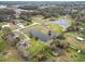 Aerial view showing house, pond, and surrounding area at 4312 Glenview Dr, Lakeland, FL 33810