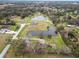 Aerial view showing home and large pond at 4312 Glenview Dr, Lakeland, FL 33810