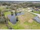 Aerial view showing a house and pond in a rural setting at 4312 Glenview Dr, Lakeland, FL 33810