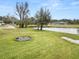 Backyard with fire pit and pond view at 4312 Glenview Dr, Lakeland, FL 33810