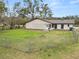 Large backyard with a fire pit and chain link fence at 4312 Glenview Dr, Lakeland, FL 33810