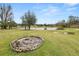 Backyard with fire pit and pond view at 4312 Glenview Dr, Lakeland, FL 33810