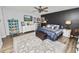 Main bedroom with king bed, built-in shelving, and light blue closet doors at 4312 Glenview Dr, Lakeland, FL 33810