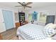 Well-lit bedroom with a comfortable bed, ceiling fan, and ample storage at 4312 Glenview Dr, Lakeland, FL 33810