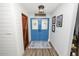 Bright entryway with blue doors and wood flooring at 4312 Glenview Dr, Lakeland, FL 33810