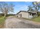 House exterior showcasing a side view and gravel driveway at 4312 Glenview Dr, Lakeland, FL 33810