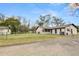 House exterior showcasing a back view, fenced yard, and firepit at 4312 Glenview Dr, Lakeland, FL 33810