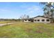 Front view of a ranch-style house with a spacious lawn at 4312 Glenview Dr, Lakeland, FL 33810