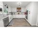 Modern white kitchen featuring stainless steel appliances at 4312 Glenview Dr, Lakeland, FL 33810