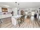 Open concept kitchen and dining area with wood floors at 4312 Glenview Dr, Lakeland, FL 33810