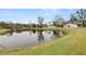 Pond view of the property with lush green grass at 4312 Glenview Dr, Lakeland, FL 33810