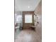 Bright bathroom featuring a glass-enclosed shower with bench, modern tile, and window at 4481 Pebble Pointe Dr, Lakeland, FL 33813