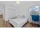 Bedroom featuring wood floors, a window, a closet, and a desk and chair at 4481 Pebble Pointe Dr, Lakeland, FL 33813