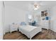 Bright bedroom featuring a window, wood floors, and built-in shelves and drawers at 4481 Pebble Pointe Dr, Lakeland, FL 33813