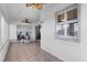 Sunroom features tiled floor and ceiling fan at 4481 Pebble Pointe Dr, Lakeland, FL 33813