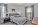 Bedroom with gray bed and neutral decor at 4512 Brookshire Pl, Lake Wales, FL 33898