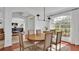 Formal dining room with wooden table, neutral decor, and large window at 4512 Brookshire Pl, Lake Wales, FL 33898